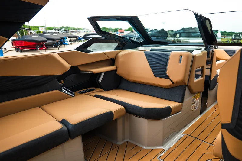Slide: The Image of Luxurious interior of 2026 MasterCraft X24 boat with tan and black seating. - 23