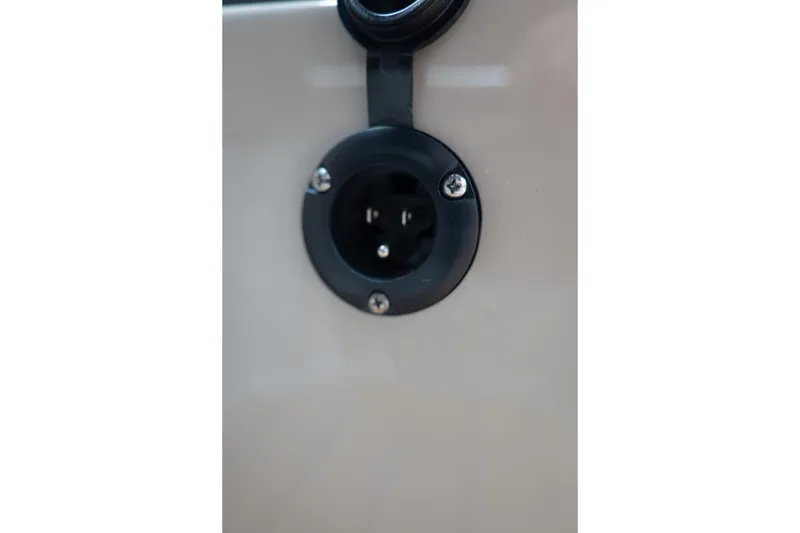Slide: The Image of Close-up of a 2026 MasterCraft X24 boat's electrical socket detail. - 27