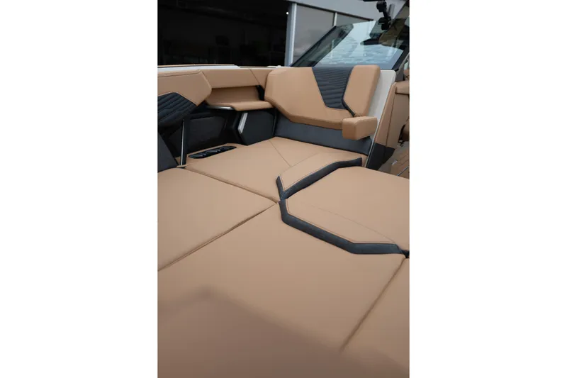 Slide: The Image of Luxurious interior seating of the 2026 MasterCraft X24 boat, featuring tan upholstery. - 32