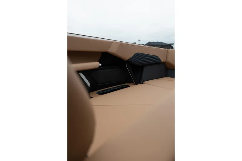 Slide: The Image of Luxurious interior of 2026 MasterCraft X24 boat with tan upholstery and sleek design. - 35