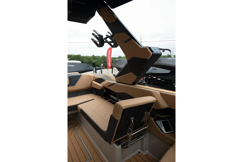 Slide: The Image of 2026 MasterCraft X24 boat interior with tan seating and sleek design elements. - 38