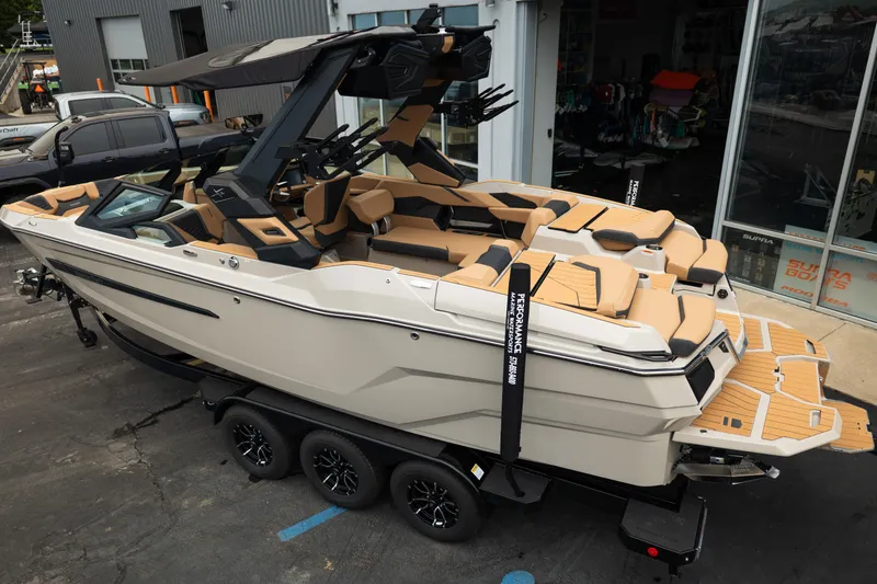 Slide: The Image of 2026 MasterCraft X24 boat on trailer, featuring sleek design and luxurious seating. - 4