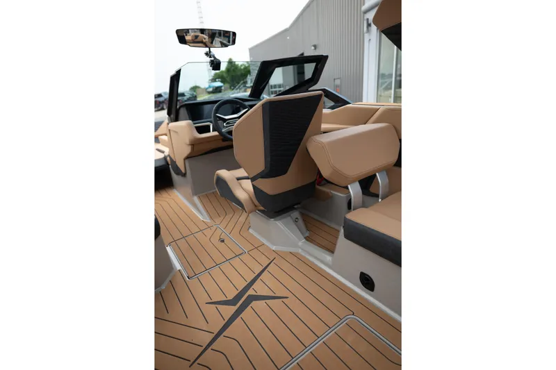 Slide: The Image of 2026 MasterCraft X24 boat interior with tan seating and sleek design. - 40