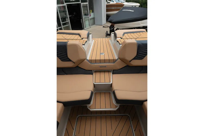 Slide: The Image of 2026 MasterCraft X24 boat interior with tan seating and sleek design. - 41