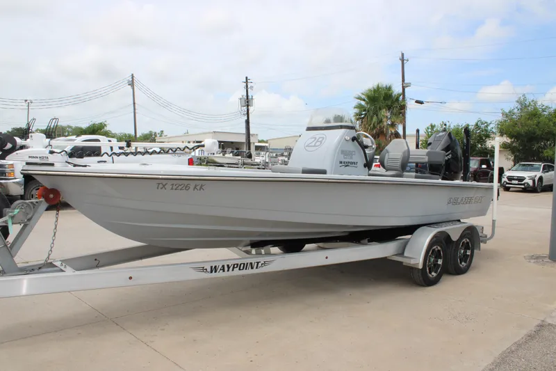 Slide: The Image of 2021 Blazer Bay 2220 GTS boat on trailer, parked outdoors. - 3