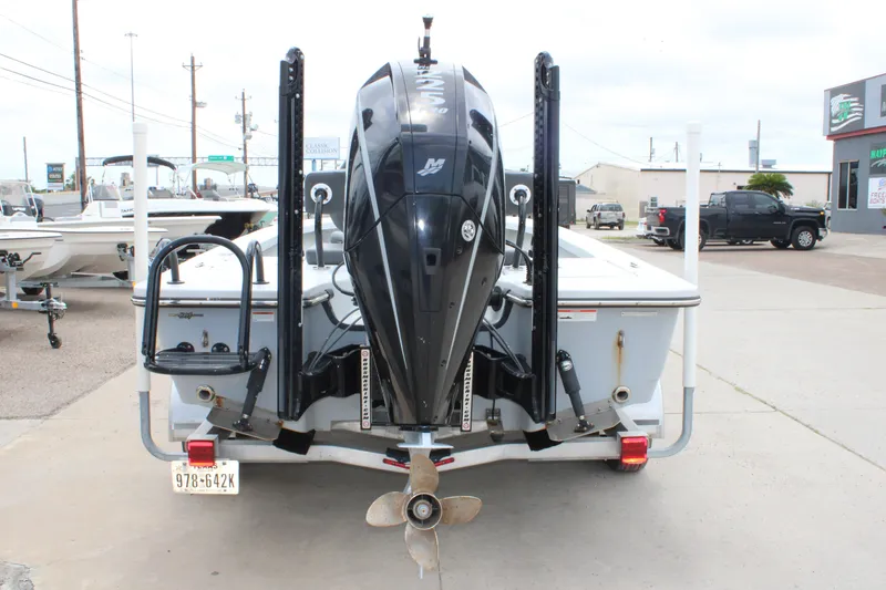 Slide: The Image of 2021 Blazer Bay 2220 GTS boat rear view with powerful outboard motor. - 6