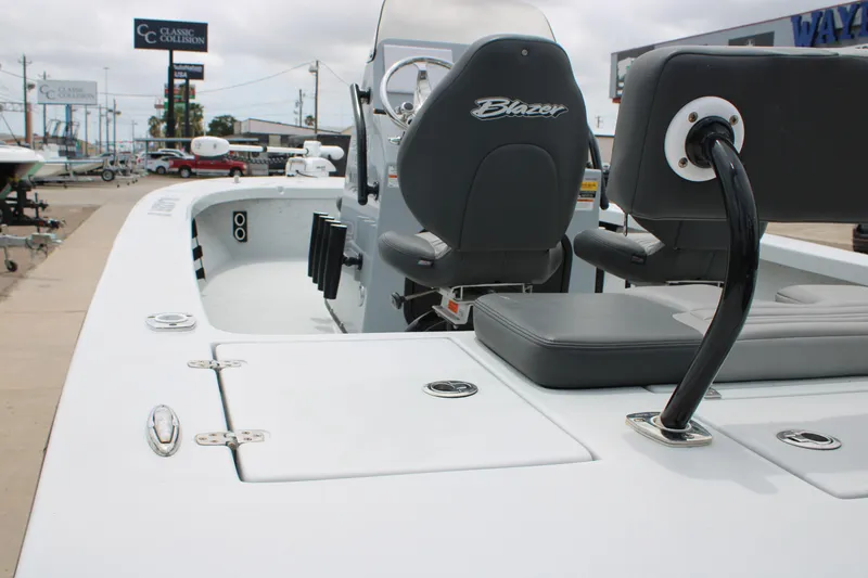 Slide: The Image of 2021 Blazer Bay 2220 GTS boat interior with seating and steering console. - 7
