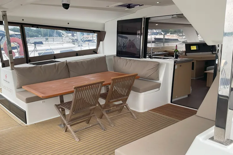 Slide: The Image of 2017 Fountaine Pajot Lucia 40 yacht interior with dining area and kitchenette. - 1