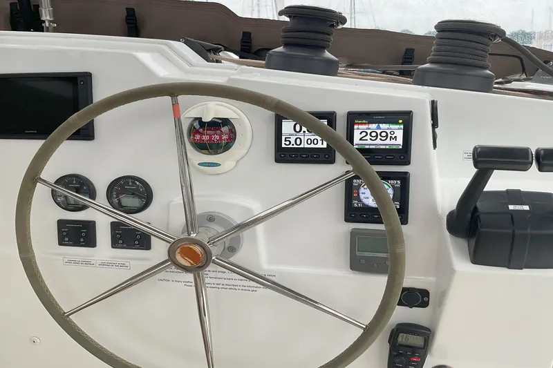 Slide: The Image of Helm of 2017 Fountaine Pajot Lucia 40 catamaran with navigation instruments and steering wheel. - 13