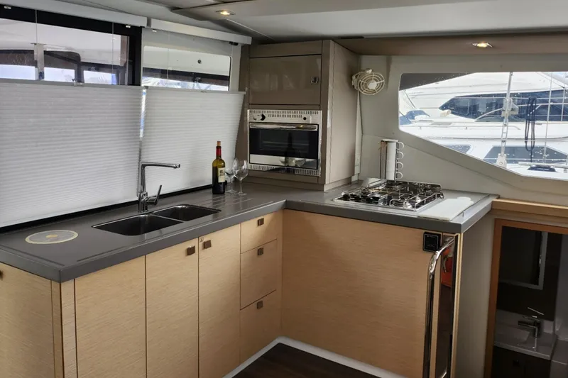 Slide: The Image of Modern kitchen interior of 2017 Fountaine Pajot Lucia 40 catamaran with appliances and window view. - 6
