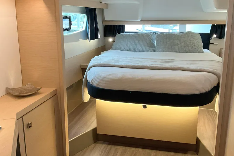 Slide: The Image of Luxurious cabin interior of 2017 Fountaine Pajot Lucia 40 catamaran, featuring a cozy bed. - 7