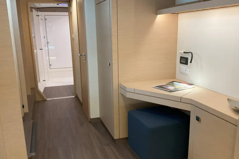 Slide: The Image of Interior of 2017 Fountaine Pajot Lucia 40 yacht with modern desk and hallway view. - 8