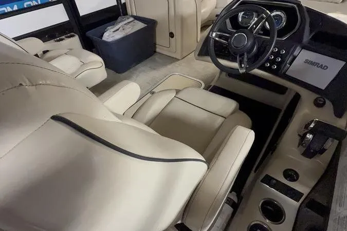 Slide: The Image of Luxurious interior of 2020 Barletta L23UC boat with plush seating and modern dashboard. - 8
