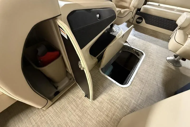 Slide: The Image of 2020 Barletta L23UC boat interior with open storage compartments and seating. - 9