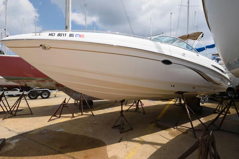 The Image of 2004 Chaparral 260 SSi boat on stands in harbor. - 0