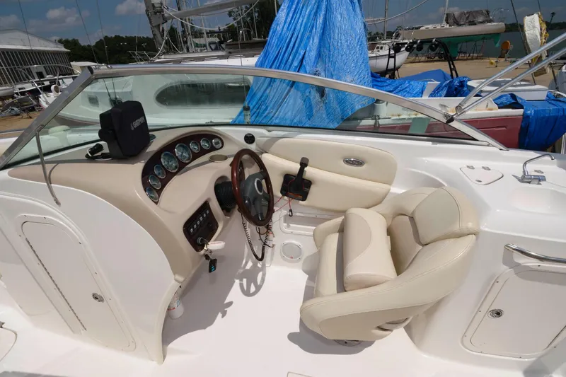 Slide: The Image of Interior of a 2004 Chaparral 260 SSi boat with steering console. - 4