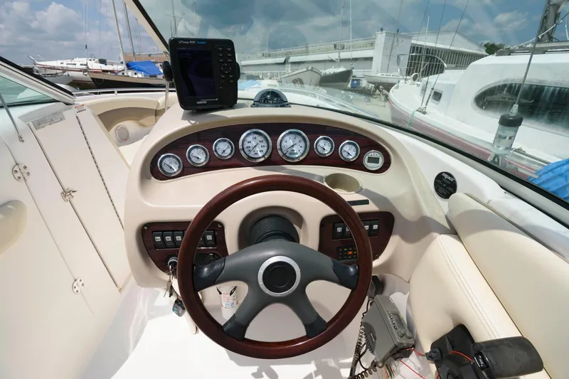 Slide: The Image of Interior view of 2004 Chaparral 260 SSi boat cockpit with steering and instruments. - 5