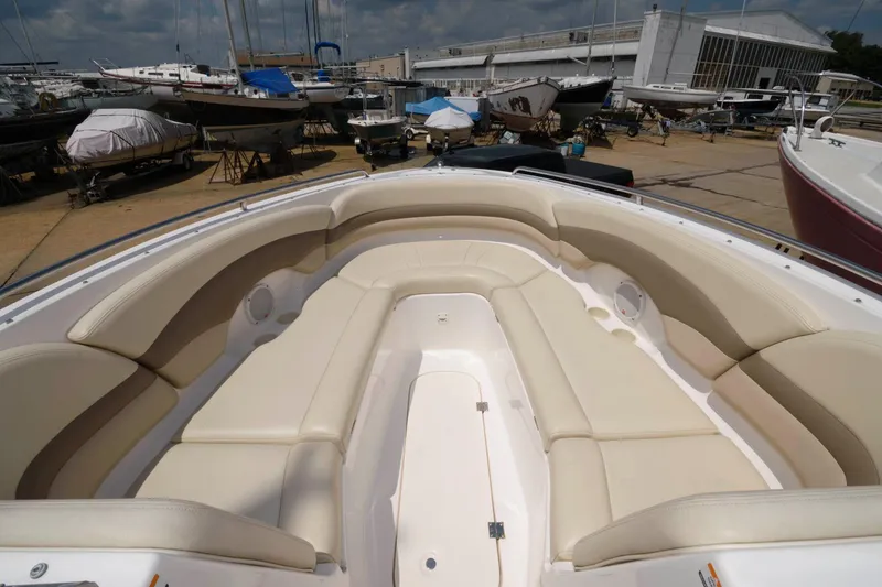 Slide: The Image of 2004 Chaparral 260 SSi boat with spacious bow area in marina. - 6