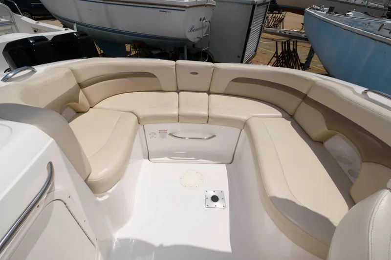 Slide: The Image of Interior of a 2004 Chaparral 260 SSi boat with beige seating. - 7