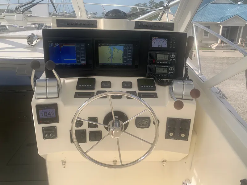 Slide: The Image of Control console of a 2003 Carolina Classic Express boat. - 1