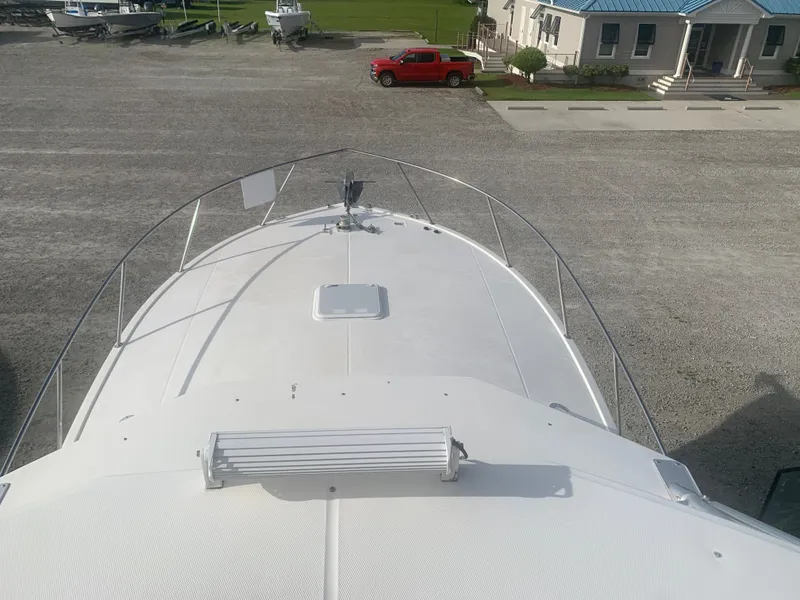 Slide: The Image of Foredeck of a 2003 Carolina Classic Express boat. - 13