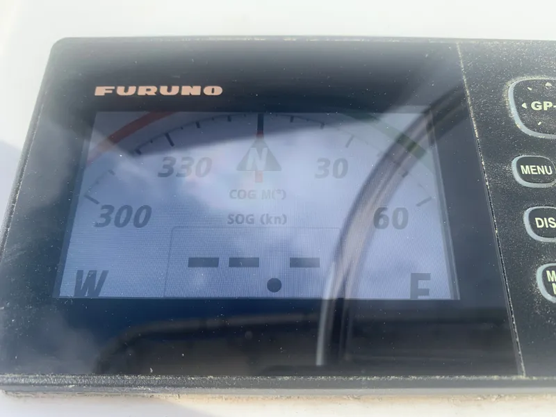 Slide: The Image of Furuno navigation device on 2003 Carolina Classic Express boat. - 19