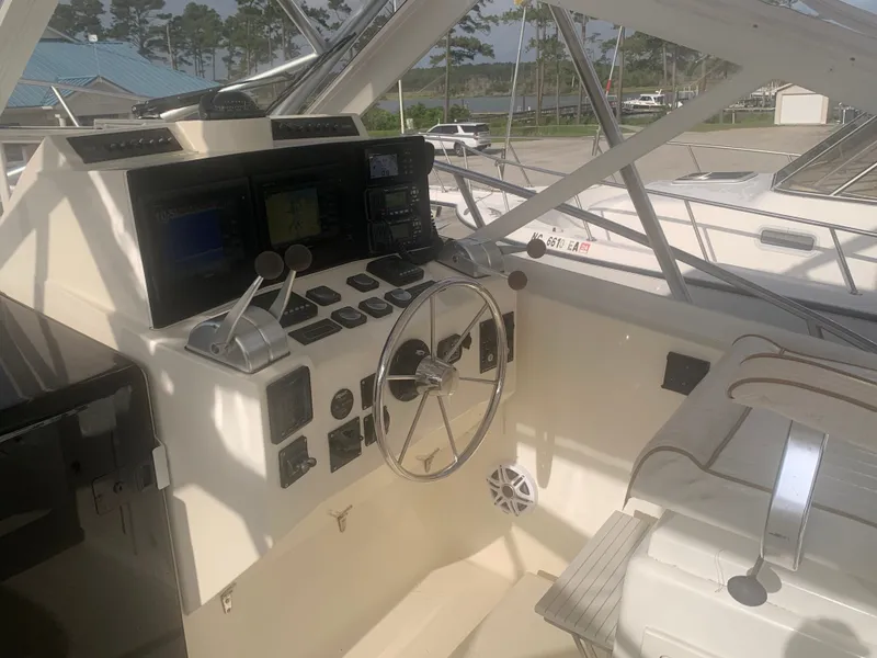 Slide: The Image of Helm of a 2003 Carolina Classic Express boat. - 21