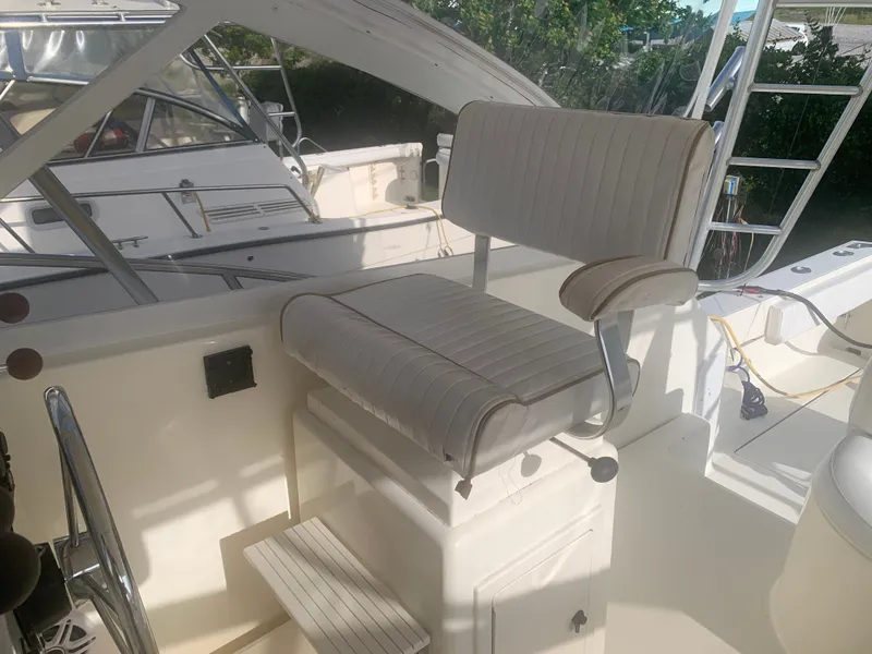 Slide: The Image of Helm chair on a 2003 Carolina Classic Express boat. - 22
