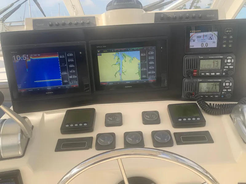 Slide: The Image of 2003 Carolina Classic Express boat helm with navigation systems. - 25