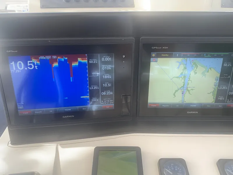 Slide: The Image of Garmin GPS displays on a 2003 Carolina Classic Express boat. - 27