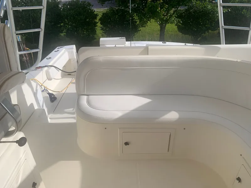 Slide: The Image of Interior of a 2003 Carolina Classic Express boat with seating area. - 30