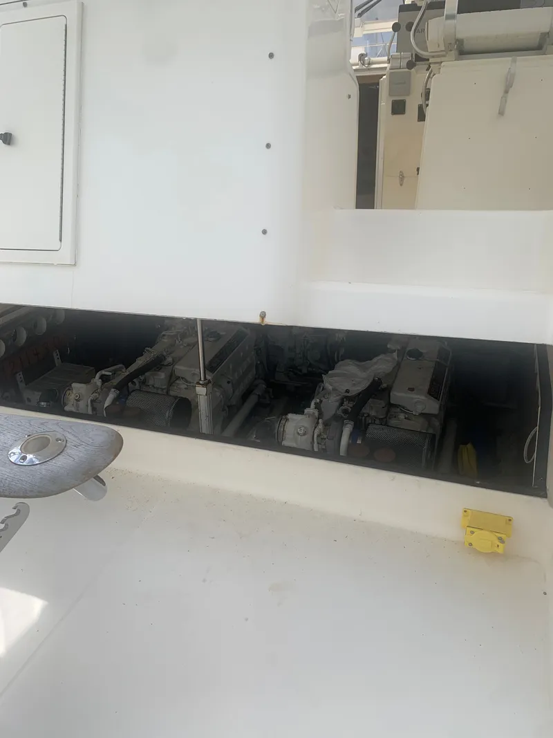 Slide: The Image of Engine compartment of a 2003 Carolina Classic Express boat. - 47