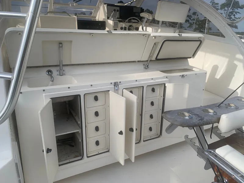 Slide: The Image of Interior of a 2003 Carolina Classic Express with storage and seating area. - 8