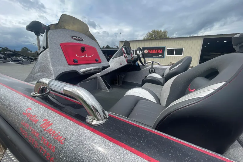 Slide: The Image of 2013 Legend Alpha 199 DCX boat interior with sleek seats and control panel. - 10