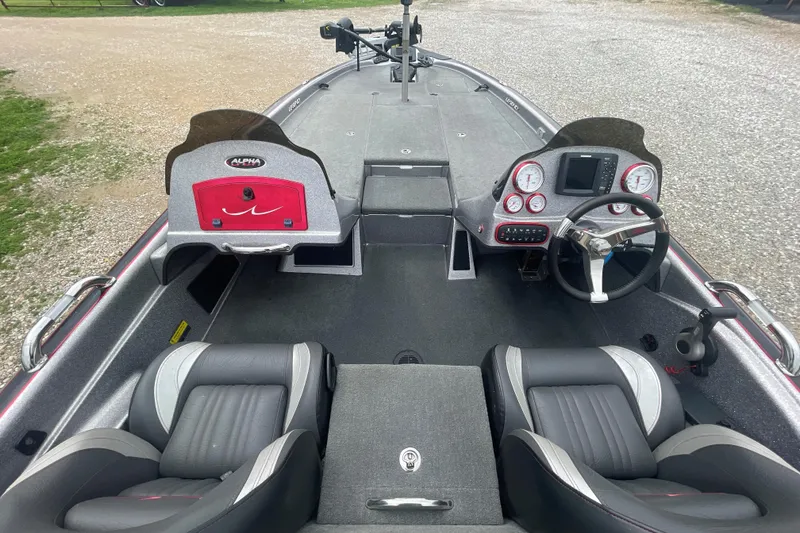 Slide: The Image of 2013 Legend Alpha 199 DCX boat interior with dual seats and modern dashboard controls. - 11