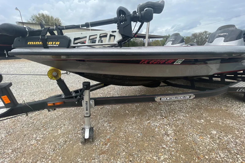 Slide: The Image of 2013 Legend Alpha 199 DCX boat on trailer with Minn Kota trolling motor. - 2