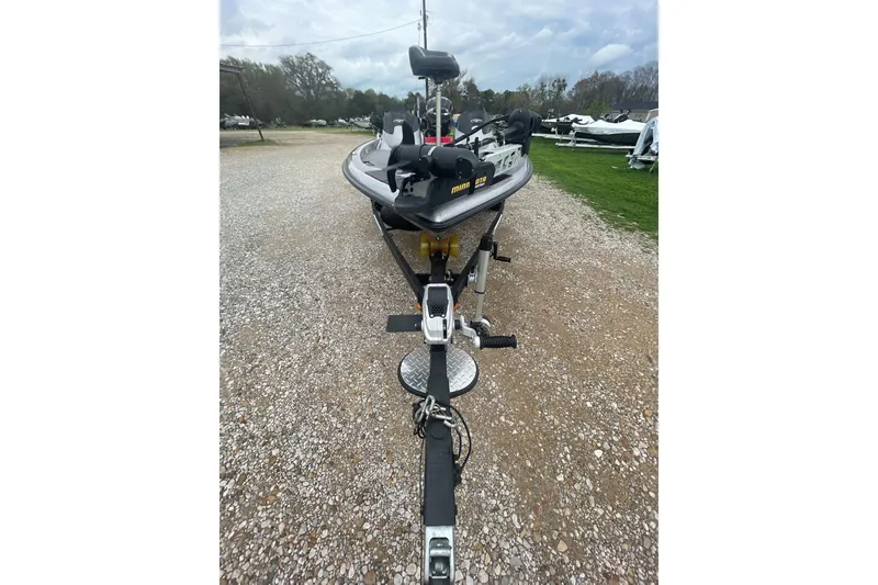 Slide: The Image of 2013 Legend Alpha 199 DCX boat on trailer, parked on gravel path under cloudy sky. - 4
