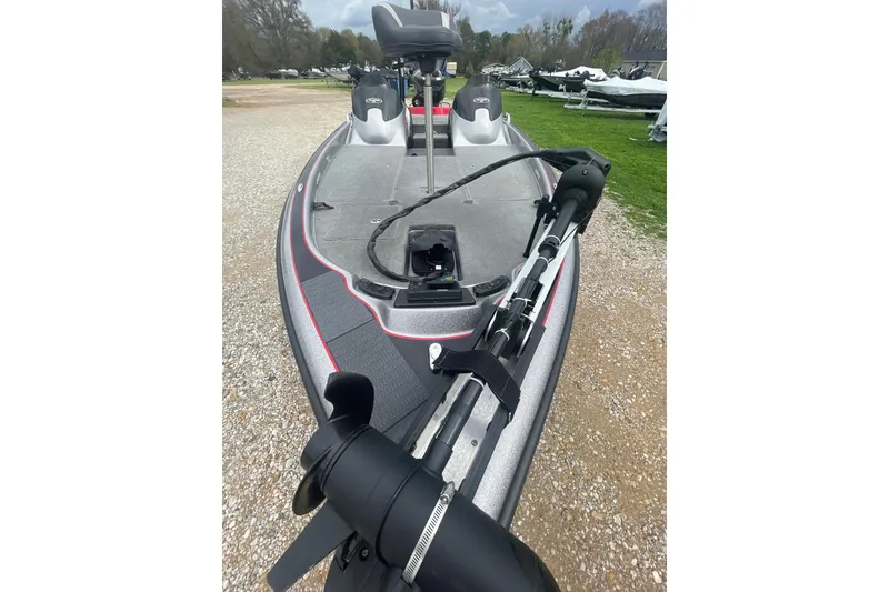 Slide: The Image of 2013 Legend Alpha 199 DCX boat with trolling motor on gravel path. - 8