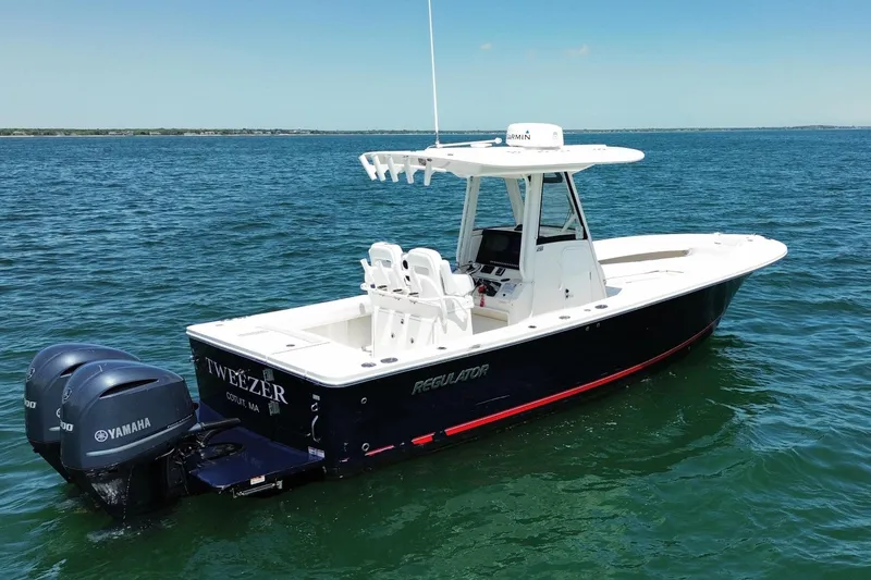 Slide: The Image of 2020 Regulator 28 boat on open sea with Yamaha engines. - 2