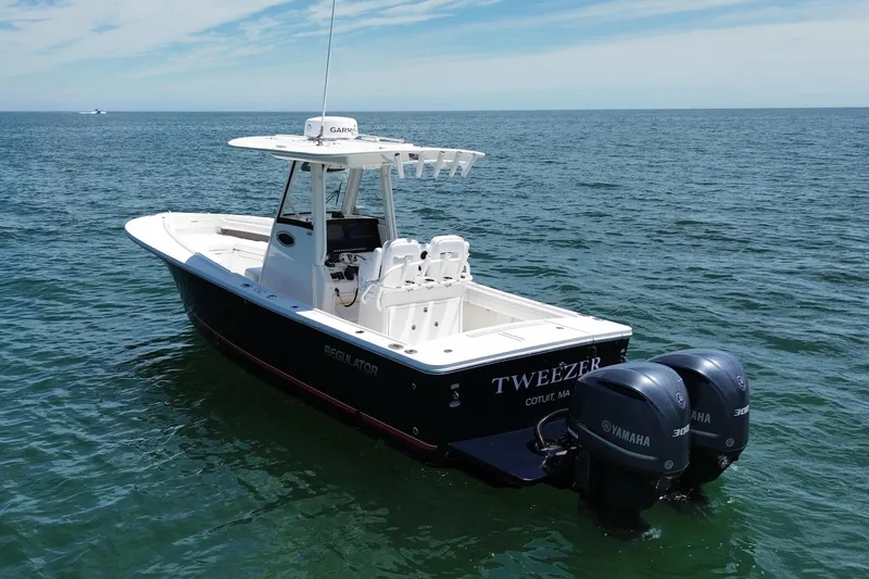 Slide: The Image of 2020 Regulator 28 boat on open sea with Yamaha engines. - 3