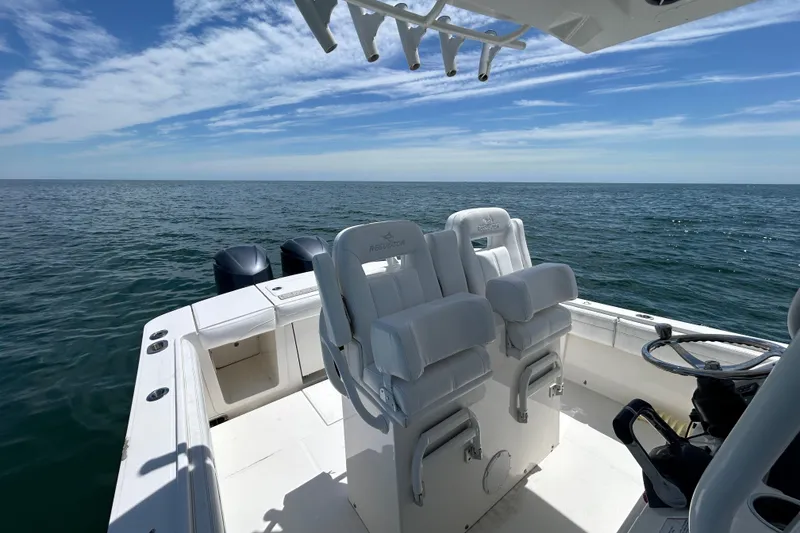 Slide: The Image of 2020 Regulator 28 boat interior with ocean view and dual seats. - 8