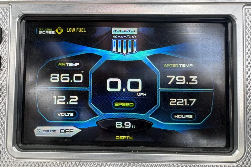 Slide: The Image of 2016 MasterCraft X26 dashboard displaying air and water temperatures, speed, and voltage. - 13