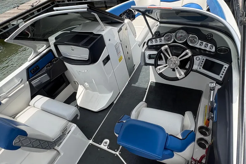 Slide: The Image of 2016 MasterCraft X26 boat interior with modern dashboard and seating. - 5