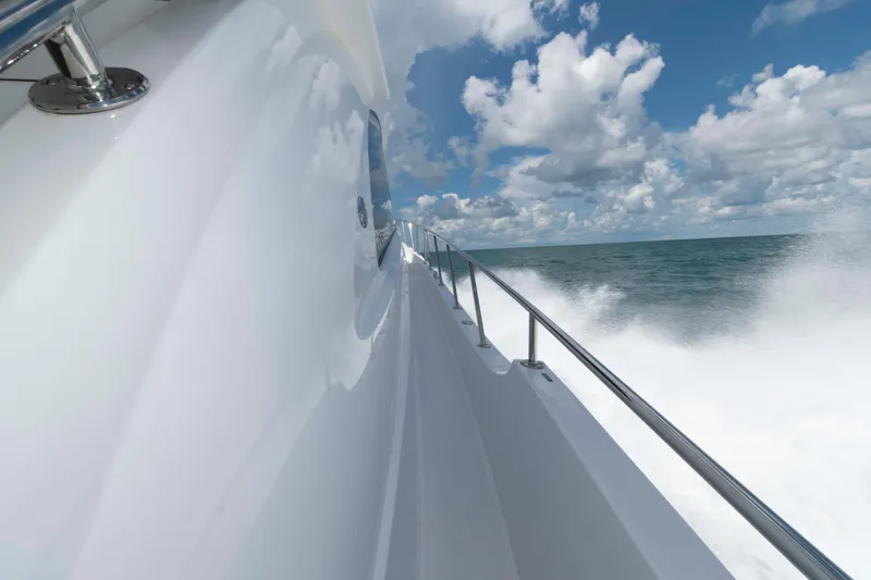 Slide: The Image of Hatteras 60 Motor Yacht 2009 cruising on open sea under blue sky. - 34