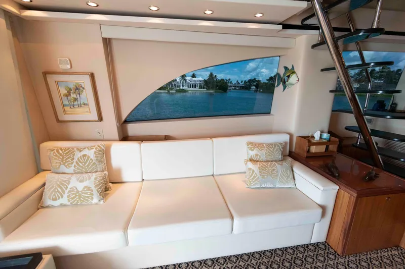 Slide: The Image of Luxurious interior of 2009 Hatteras 60 Motor Yacht with elegant seating and scenic window view. - 42