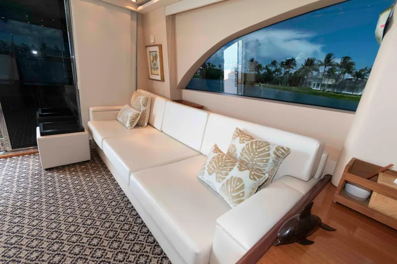 Slide: The Image of Luxurious interior of 2009 Hatteras 60 Motor Yacht with white sofa and decorative pillows. - 43