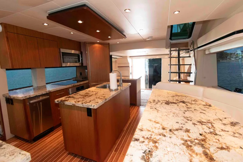 Slide: The Image of Luxurious interior of 2009 Hatteras 60 Motor Yacht with modern kitchen and elegant design. - 51