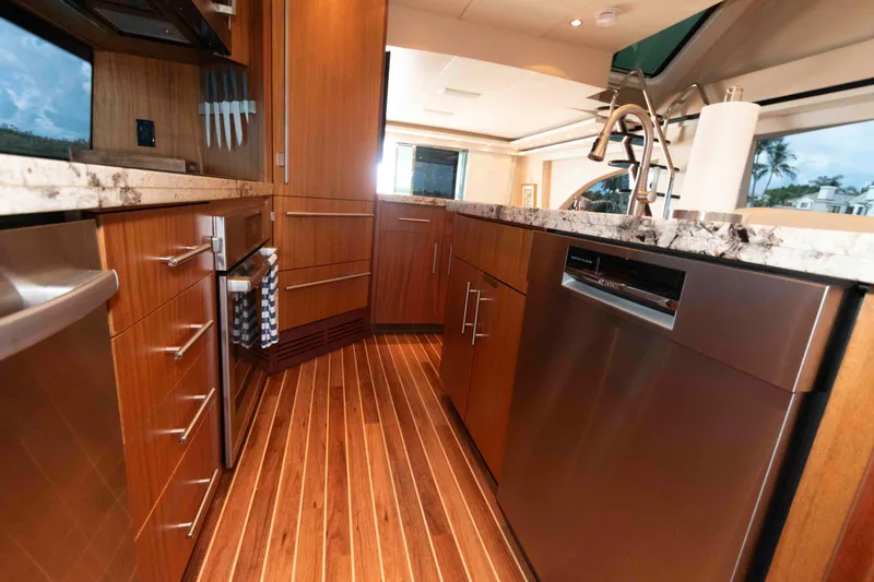 Slide: The Image of Luxurious kitchen interior of 2009 Hatteras 60 Motor Yacht with modern appliances and wood finish. - 53