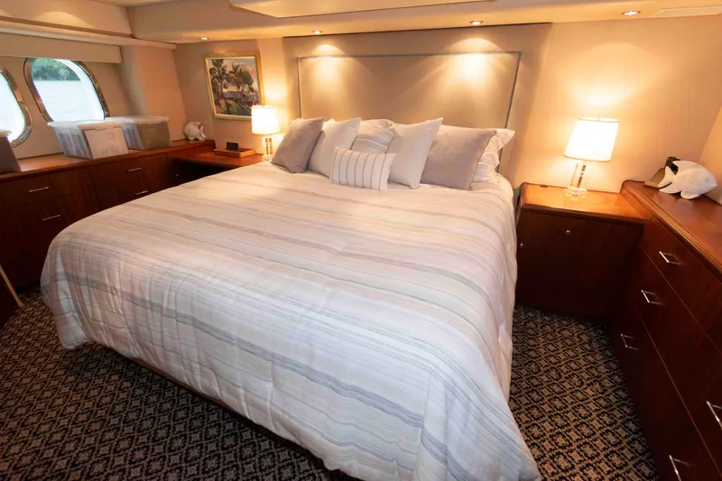 Slide: The Image of Luxurious bedroom interior of 2009 Hatteras 60 Motor Yacht with elegant decor and lighting. - 60