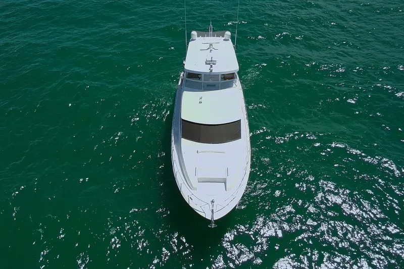 Slide: The Image of 2009 Hatteras 60 Motor Yacht cruising on open water, aerial view. - 7